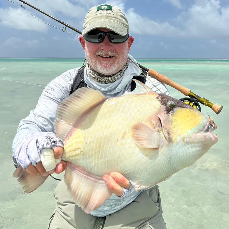 Jack with a Triggerfish Jack with Triggerfish during a Fishing with Larry hosted week at The Villages on Christmas Island.